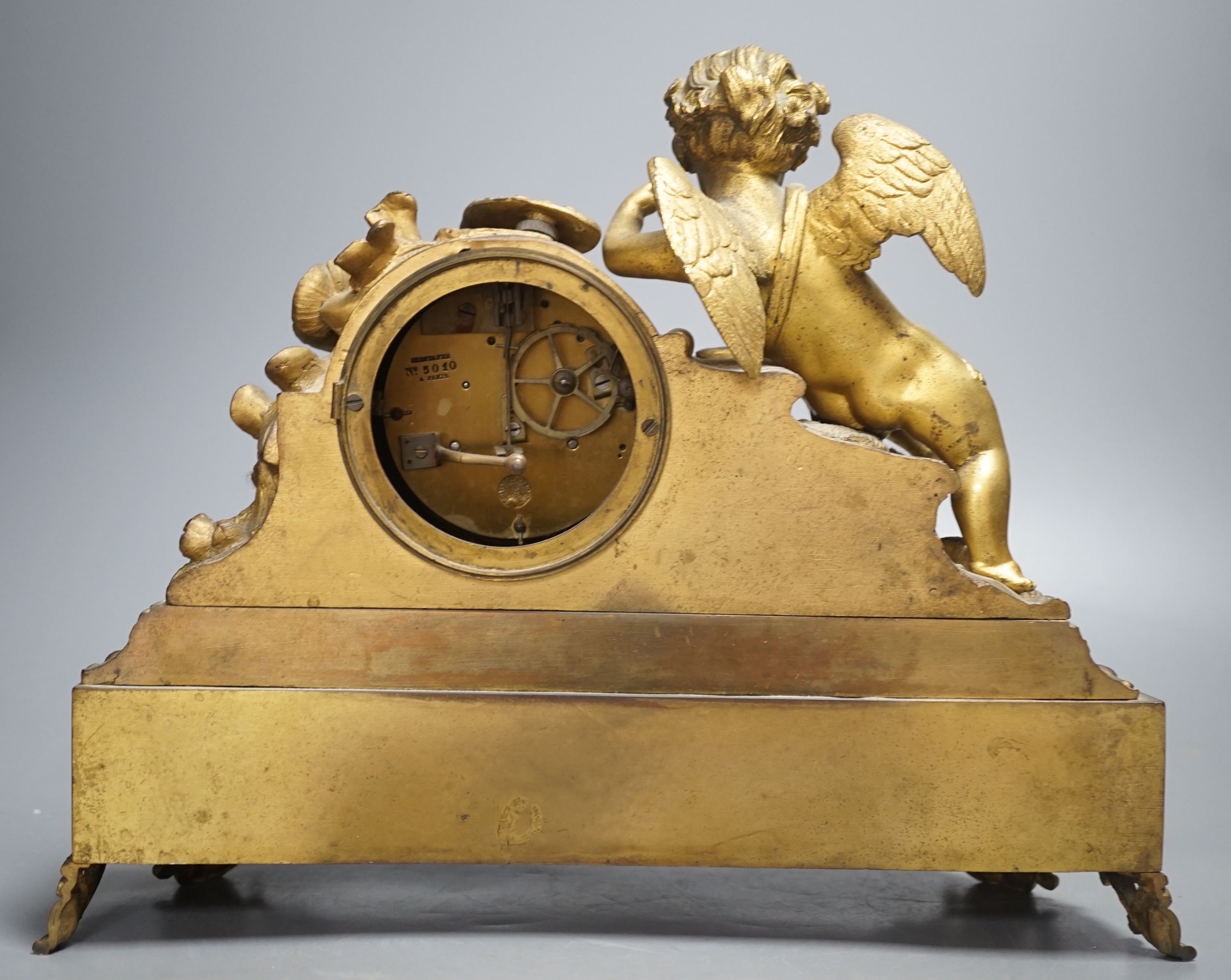 A French ormolu and Sevres style porcelain mounted putti mantel clock by Le Roy et Fils, Palais Royale, Paris, 26 cms high.